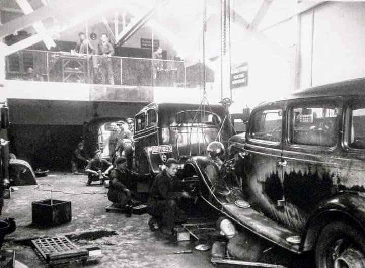 A motor-repair workshop, the 1930s — a repair hall with a mezzanine. Illustrative photograph from the project's collection.