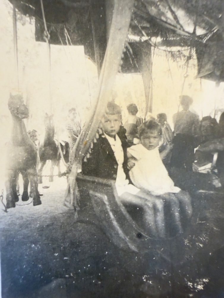 Tadeusz and Irena on the carousel — a rare moment of a child's joy in the middle of the war. From a private collection.
