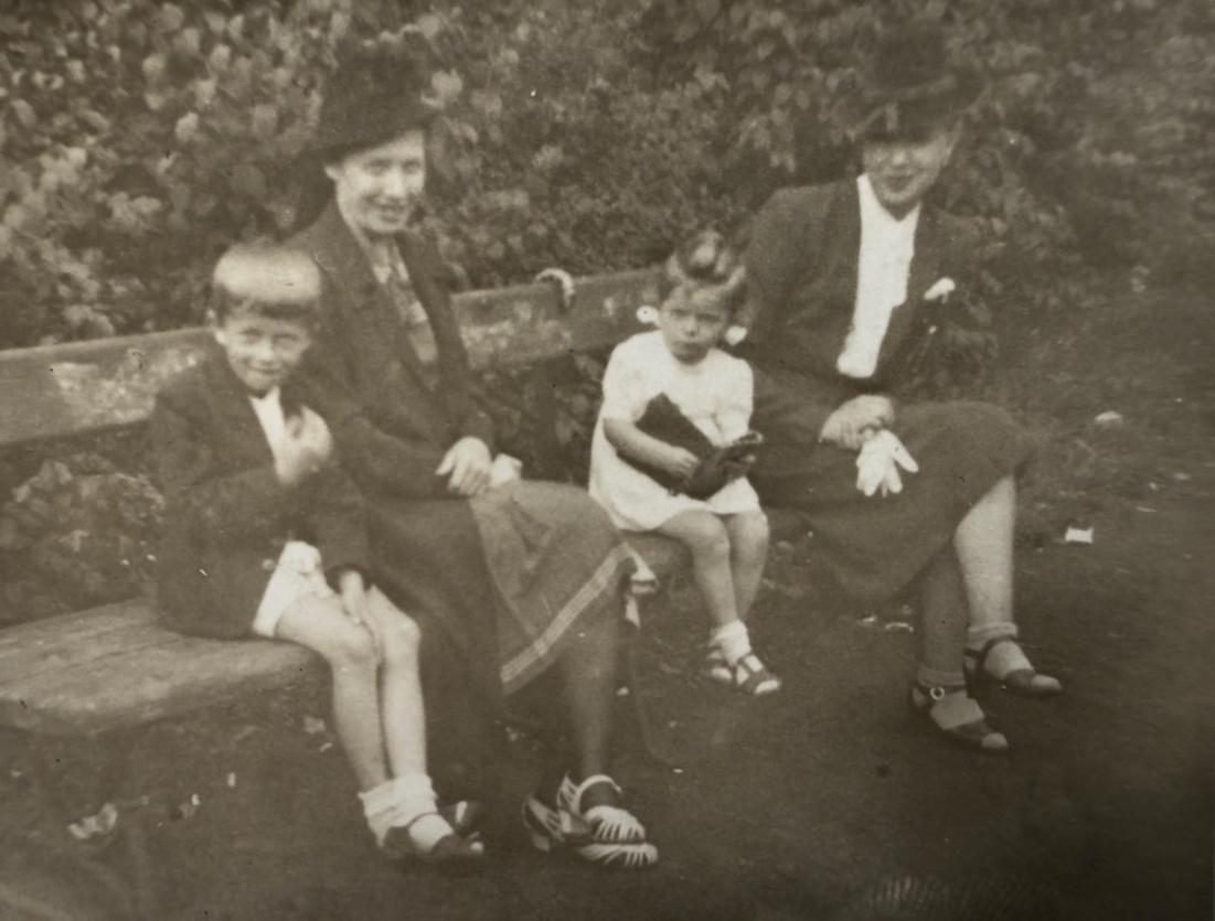 Natalia with the children and a friend on a walk in the park, the occupation years. From a private collection.