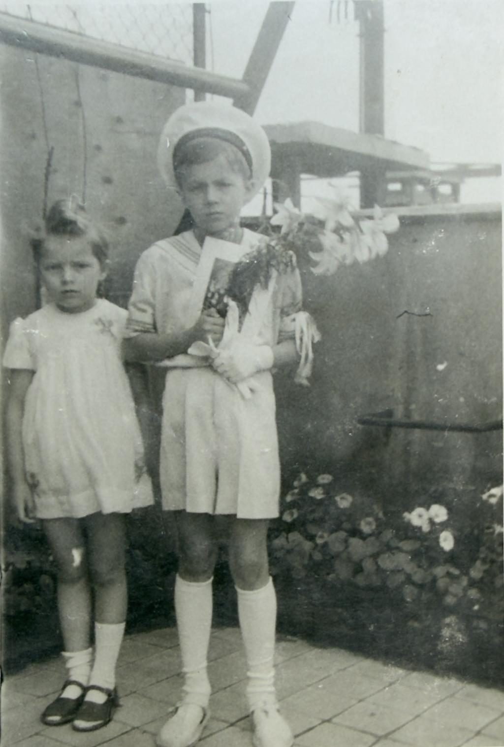 Tadeusz after his First Communion, probably 1945. Beside him his younger sister Irena. The celebration, like many family moments, recorded on the roof. From a private collection.