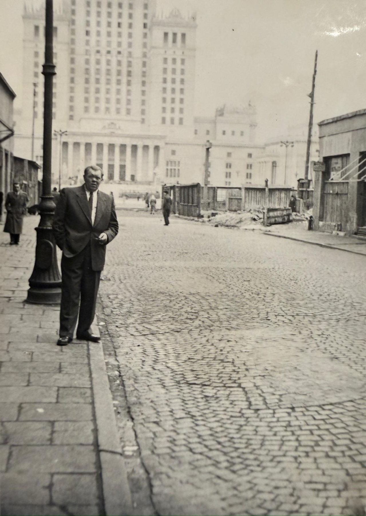 Stanisław against the rising Palace of Culture and Science — Warsaw, first half of the 1950s. From a private collection.